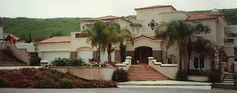 Spanish-style estate entry with cascading plantings and stone stairway — San Juan Capistrano, CA