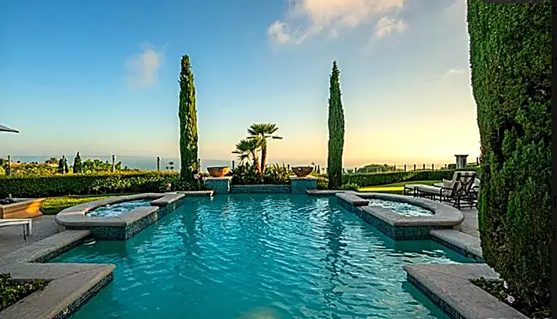 Infinity pool and spa at sunset — Newport Beach, CA